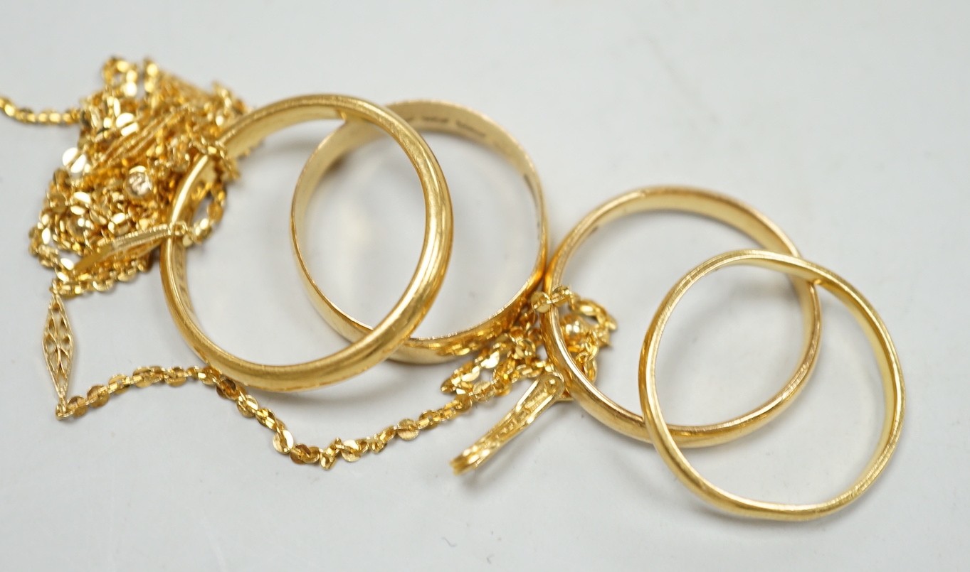 Four assorted 22ct gold wedding bands, including Birmingham, 1913, size P/Q and a 22k fine link chain, 46cm, gross 13.1 grams.